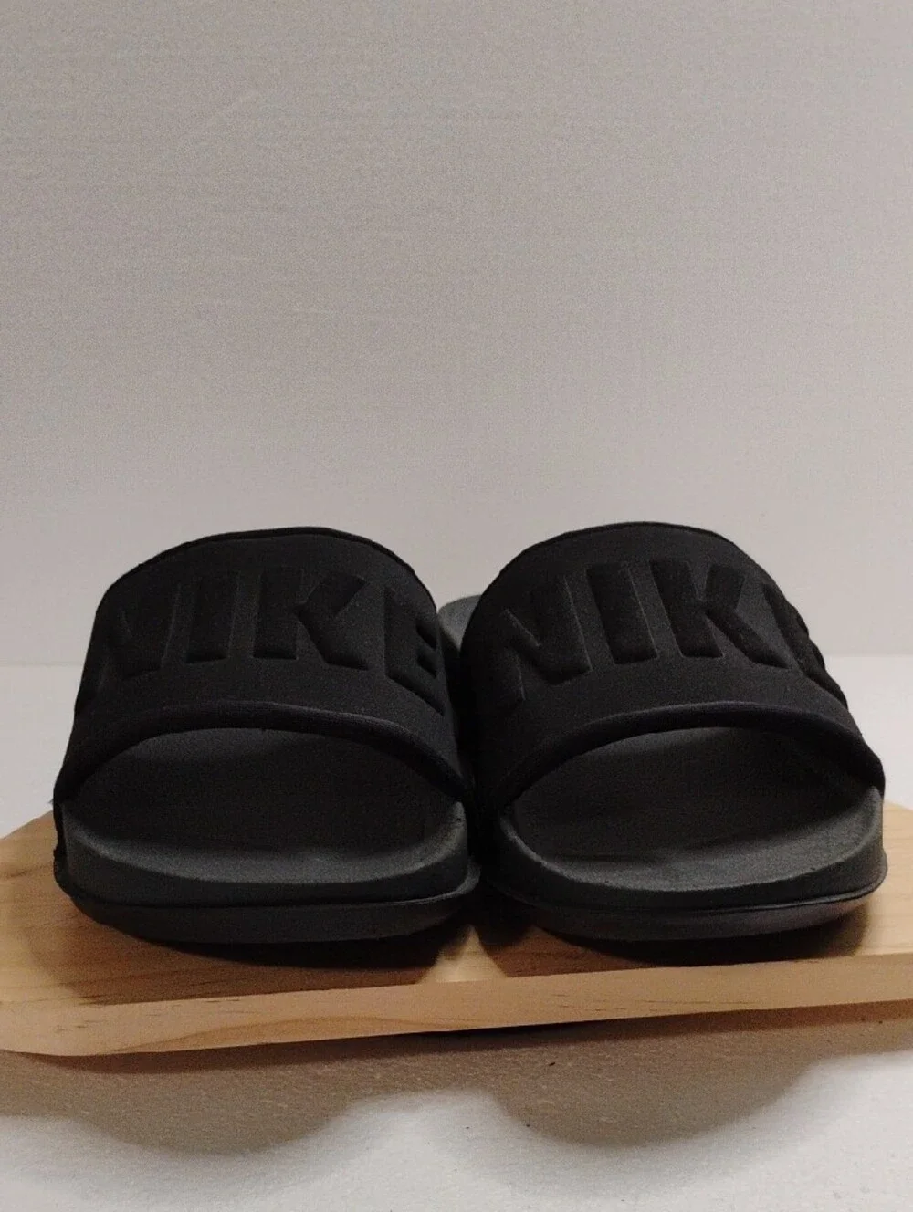 Nike Black Slide Sandals with Embossed NIKE Strap
